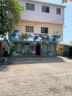 a building with a mural on the side of it at Playa El Obispo E La Marea building La Libertad in La Libertad