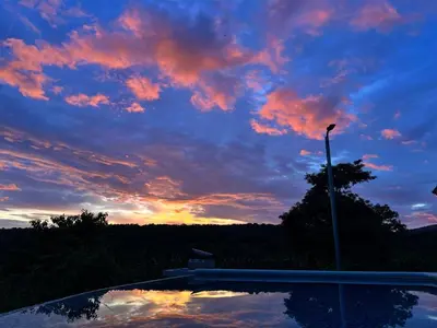 a view of a sunset with a sky at Rancho Agua Fria in Jucuarán