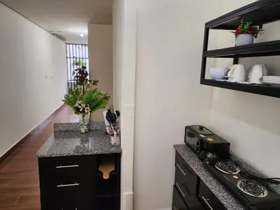 a kitchen with a counter top and a stove at Gywel in San Salvador