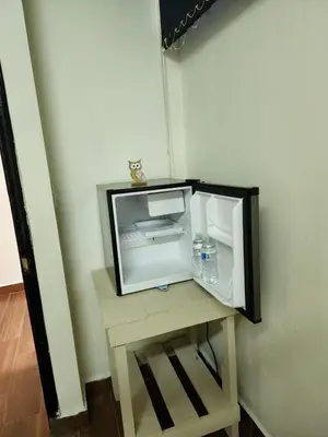 a small tv sitting on a table in a room at Gywel in San Salvador