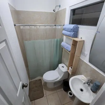 a small bathroom with a toilet and a sink at Apartamento Familiar in Santa Ana