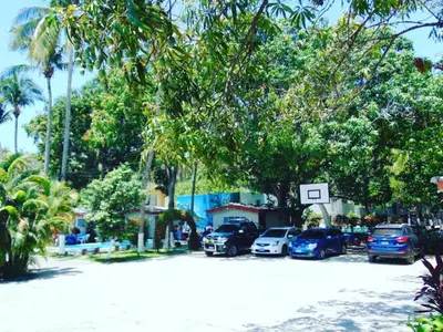 a group of cars parked in a parking lot at Rincon del atardecer in La Libertad