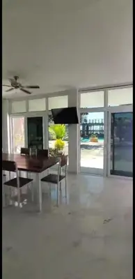 a living room with a dining room table and chairs at Beach house playa san diego in La Libertad