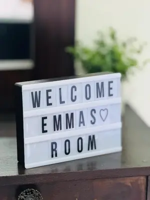 a sign that says welcome to emmaus room at Emmitas room in La Unión