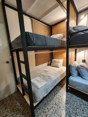 a group of bunk beds in a room at Mochila Urbana6 in San Salvador