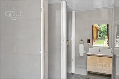 a bathroom with a sink and a mirror at Cozy Bedroom in a coffee farmn in Coatepeque Lake in Santa Ana