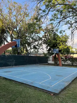 a blue tennis court with a basketball hoop on it at Game Room • Pool • Fire Pit • Resort Access in Los Cóbanos