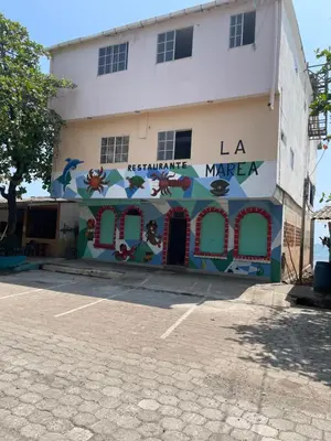 a building with a mural on the side of it at Playa El Obipo C La Marea building La Libertad in La Libertad